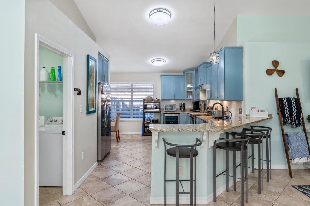 Beautiful Pet Friendly Home! Tropical Pool, Optional Golf Cart & Pool Heat, Minutes to Beach photo
