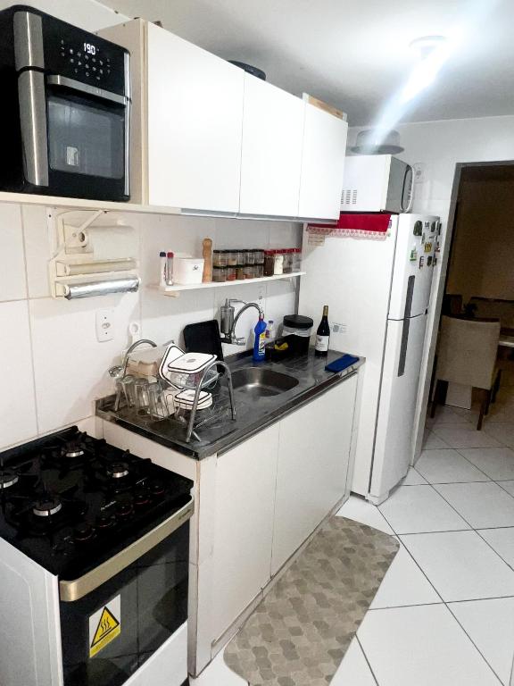 Kuchyň nebo kuchyňský kout v ubytování Quarto Encantado