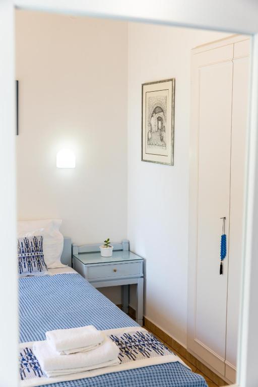 Postel nebo postele na pokoji v ubytování Hotel Dina