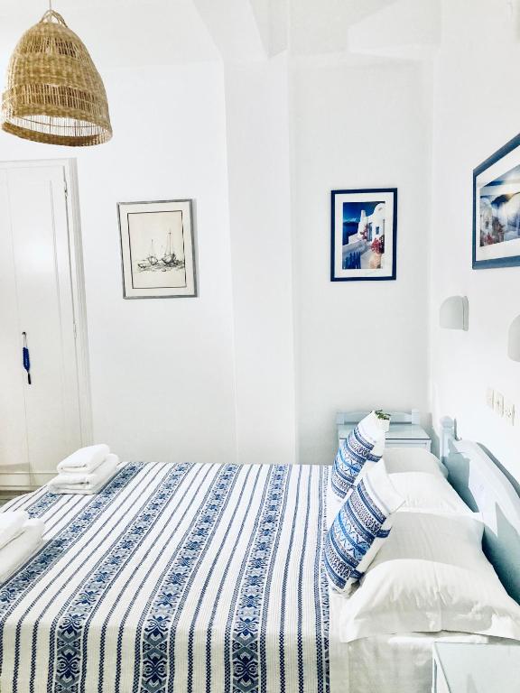 Postel nebo postele na pokoji v ubytování Hotel Dina