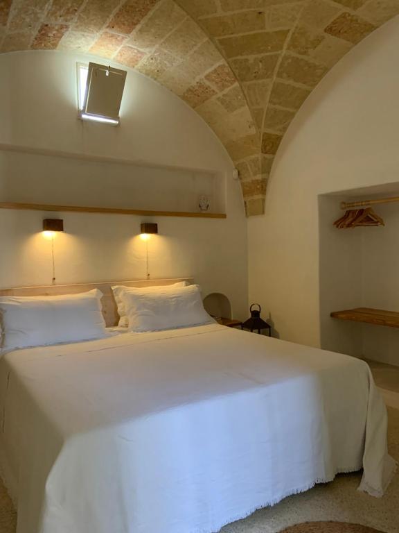 Postel nebo postele na pokoji v ubytování Relais Masseria Sant'Antonio