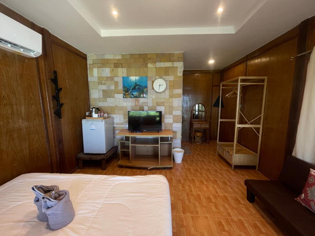 Postel nebo postele na pokoji v ubytování Apache Loongdum Koh Samed