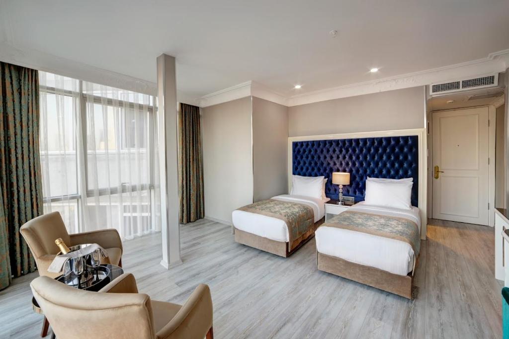 تصویر اتاق‌های White Monarch Hotel - تصویر ۲