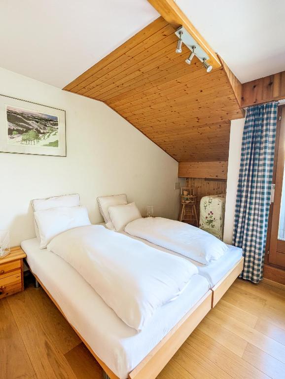 Postel nebo postele na pokoji v ubytování Penthouse à Nendaz avec Terrasse et Vue Panoramique Exceptionnelle