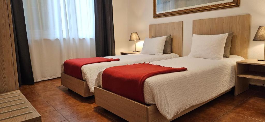 Postel nebo postele na pokoji v ubytování Hotel Elvezia - Self Check-in
