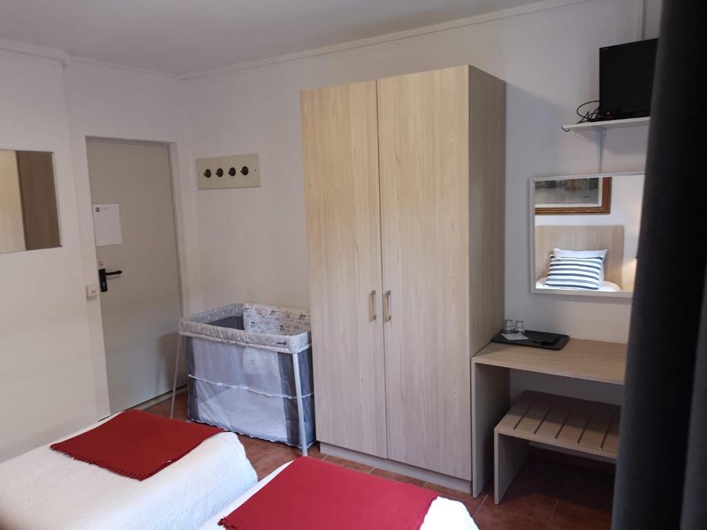 Postel nebo postele na pokoji v ubytování Hotel Elvezia - Self Check-in