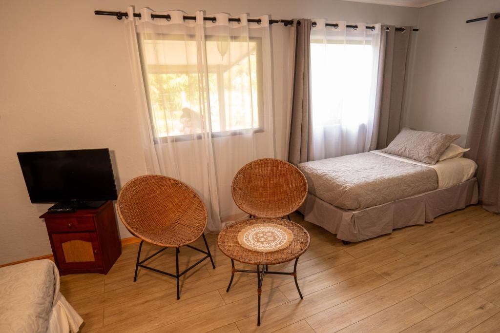 Una cama o camas en una habitación de Hotel Uka Mana