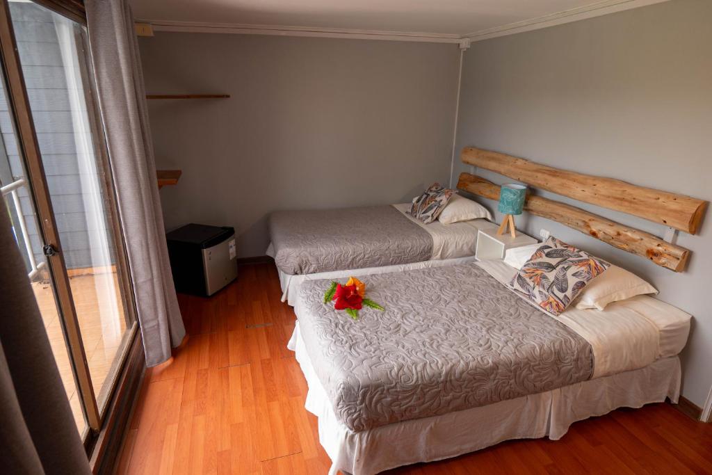 Una cama o camas en una habitación de Hotel Uka Mana