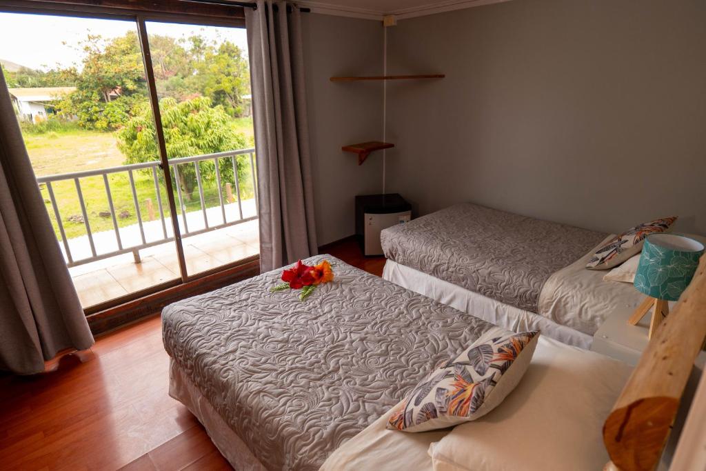 Una cama o camas en una habitación de Hotel Uka Mana