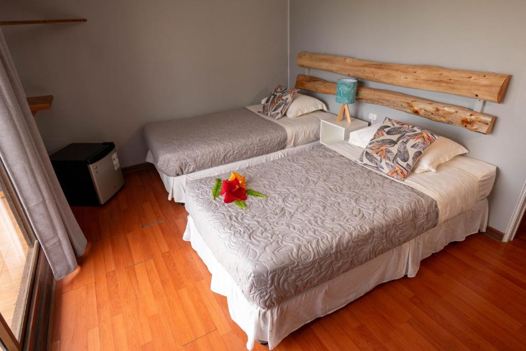 Una cama o camas en una habitación de Hotel Uka Mana