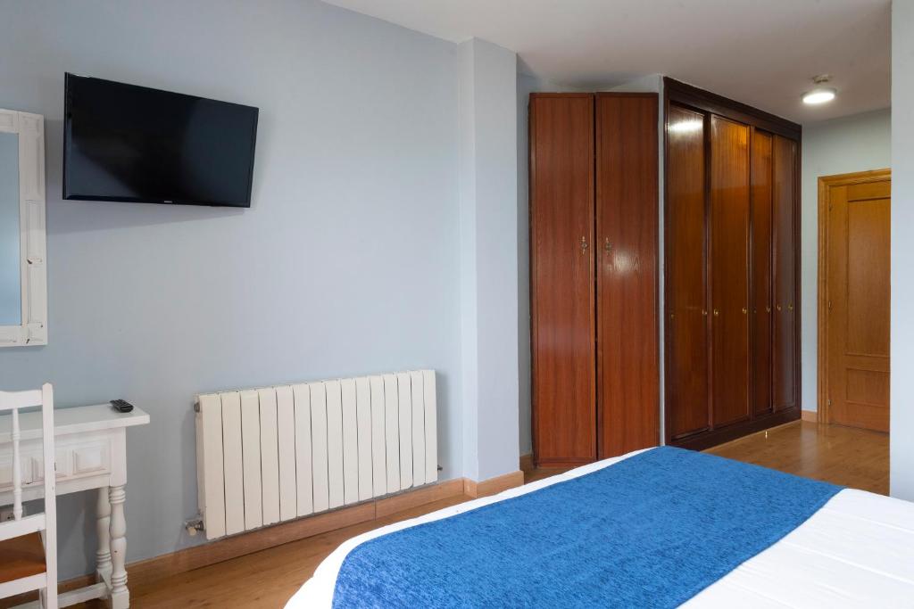 Posteľ alebo postele v izbe v ubytovaní Hotel Campomar