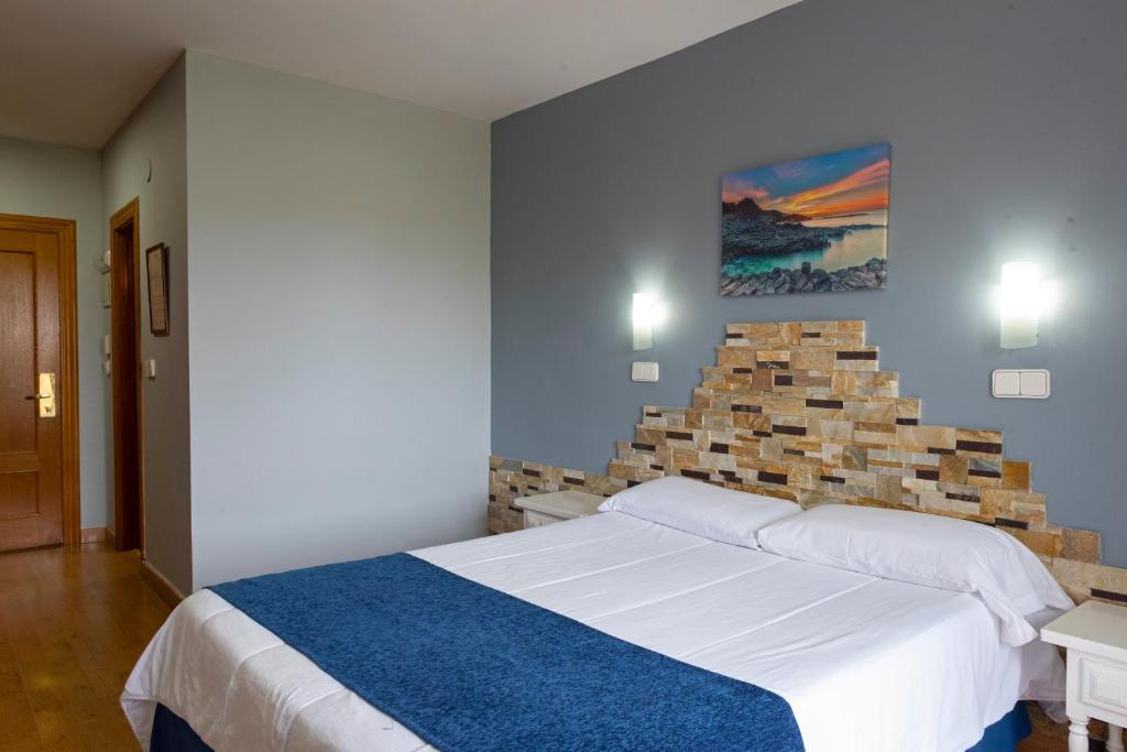 Posteľ alebo postele v izbe v ubytovaní Hotel Campomar