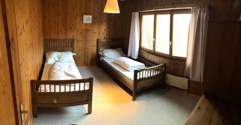 Postel nebo postele na pokoji v ubytování Chalet Valdonga