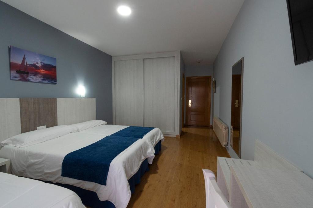 Posteľ alebo postele v izbe v ubytovaní Hotel Campomar
