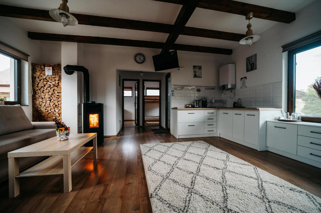 a kitchen with a couch and a table in a room at Aqua Garden in Miercurea-Ciuc