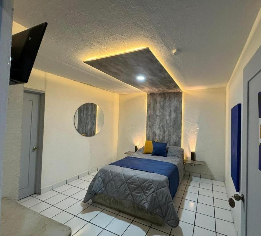 Postel nebo postele na pokoji v ubytování Hotel Urban Matamoros