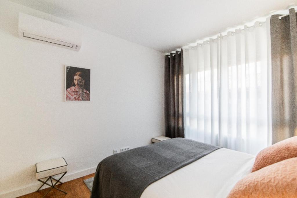 Postel nebo postele na pokoji v ubytování Moderno y Luminoso - Heros