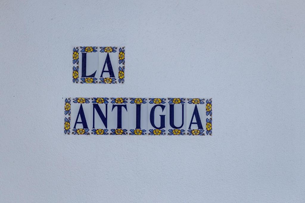 a sign with the words antigua in the sky at Casa La Antigua in Cardeña