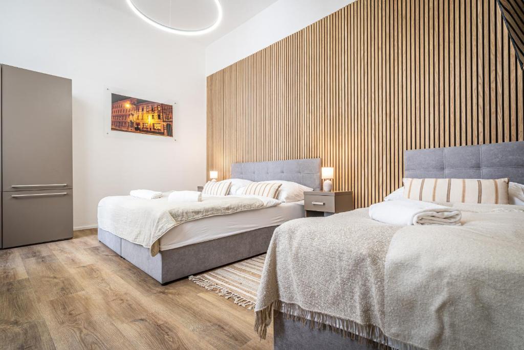 Postel nebo postele na pokoji v ubytování Apartmánový Dům Centrum