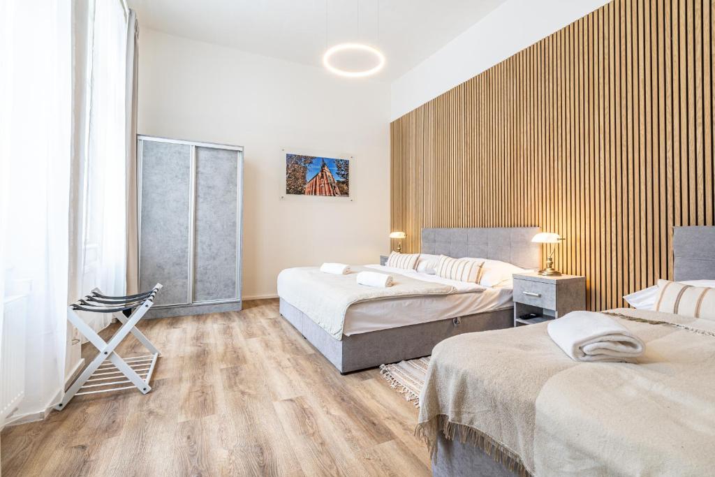 Postel nebo postele na pokoji v ubytování Apartmánový Dům Centrum