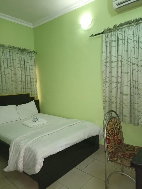Rúm í herbergi á Haute Aparthotel