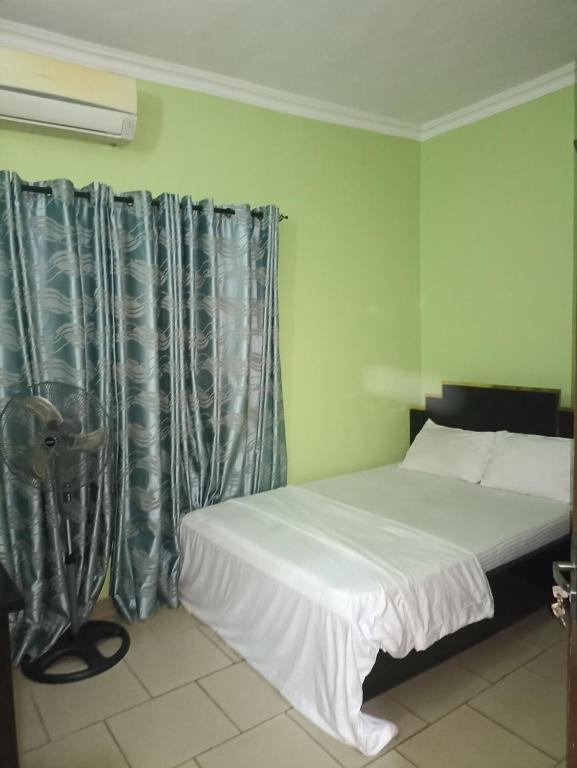 Rúm í herbergi á Haute Aparthotel