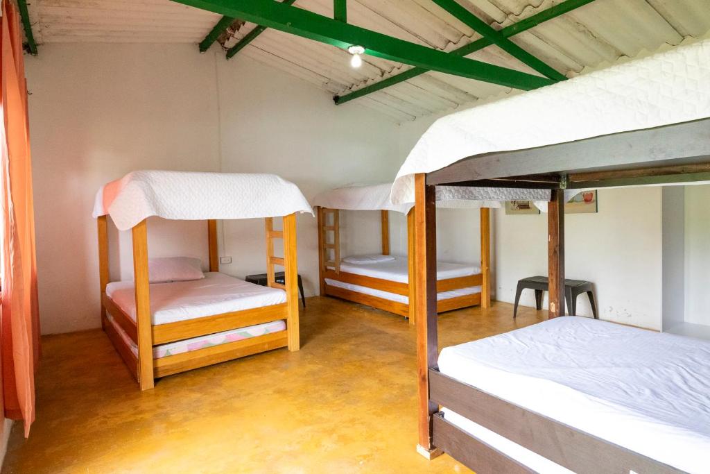 Postel nebo postele na pokoji v ubytování Hacienda Milán