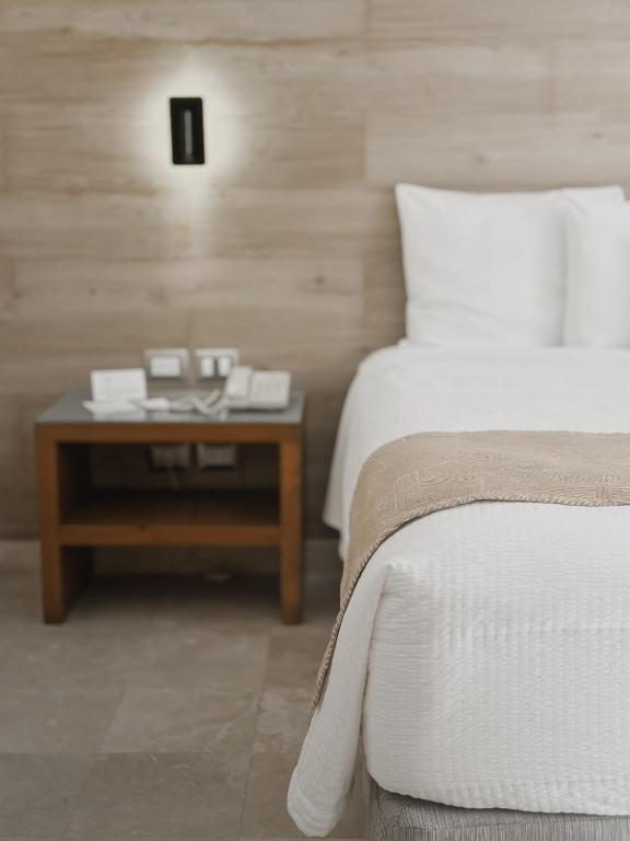 Postel nebo postele na pokoji v ubytování Hotel Catedral La Paz