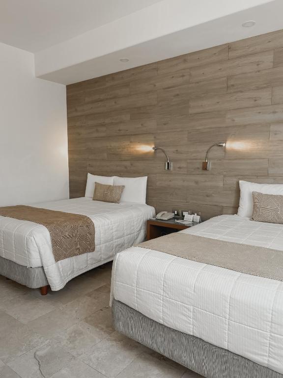 Postel nebo postele na pokoji v ubytování Hotel Catedral La Paz