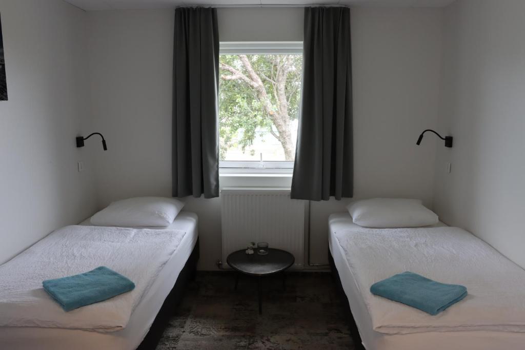 Voodi või voodid majutusasutuse Höfn Hostel toas