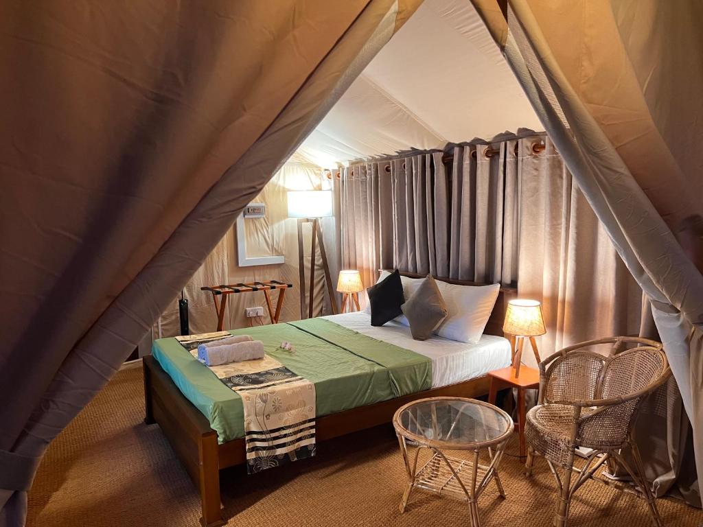 Postel nebo postele na pokoji v ubytování AT ONE - with Nature Glamping Resort