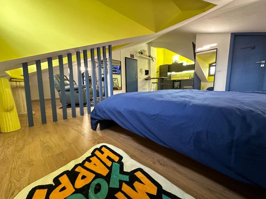 En eller flere senge i et værelse på Mirabella Loft