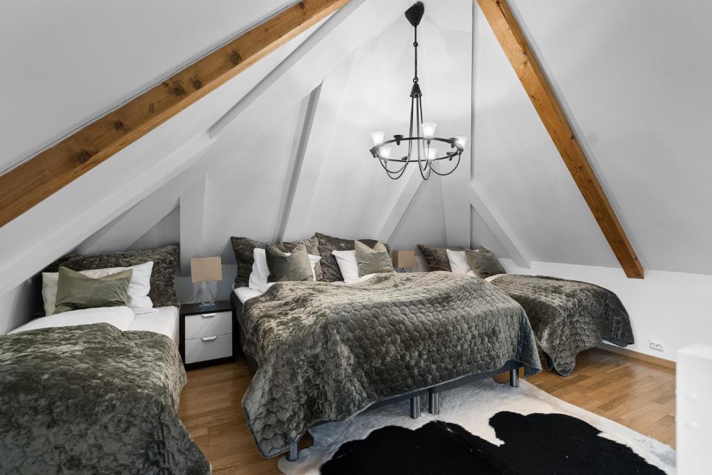 Postel nebo postele na pokoji v ubytování BraMy Apartments The Bucks Villa
