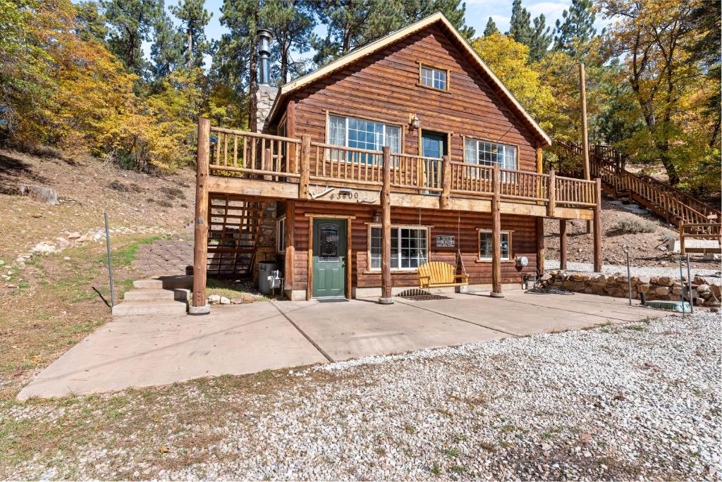 a large wooden house with a large deck at Norske Nooke - Experience the best of Big Bear Walk to Bear Mountain and the Golf Course in Big Bear Lake