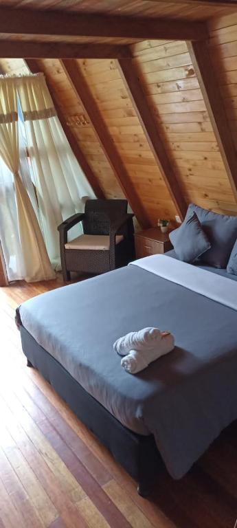 Postel nebo postele na pokoji v ubytování Cabañas Alpina