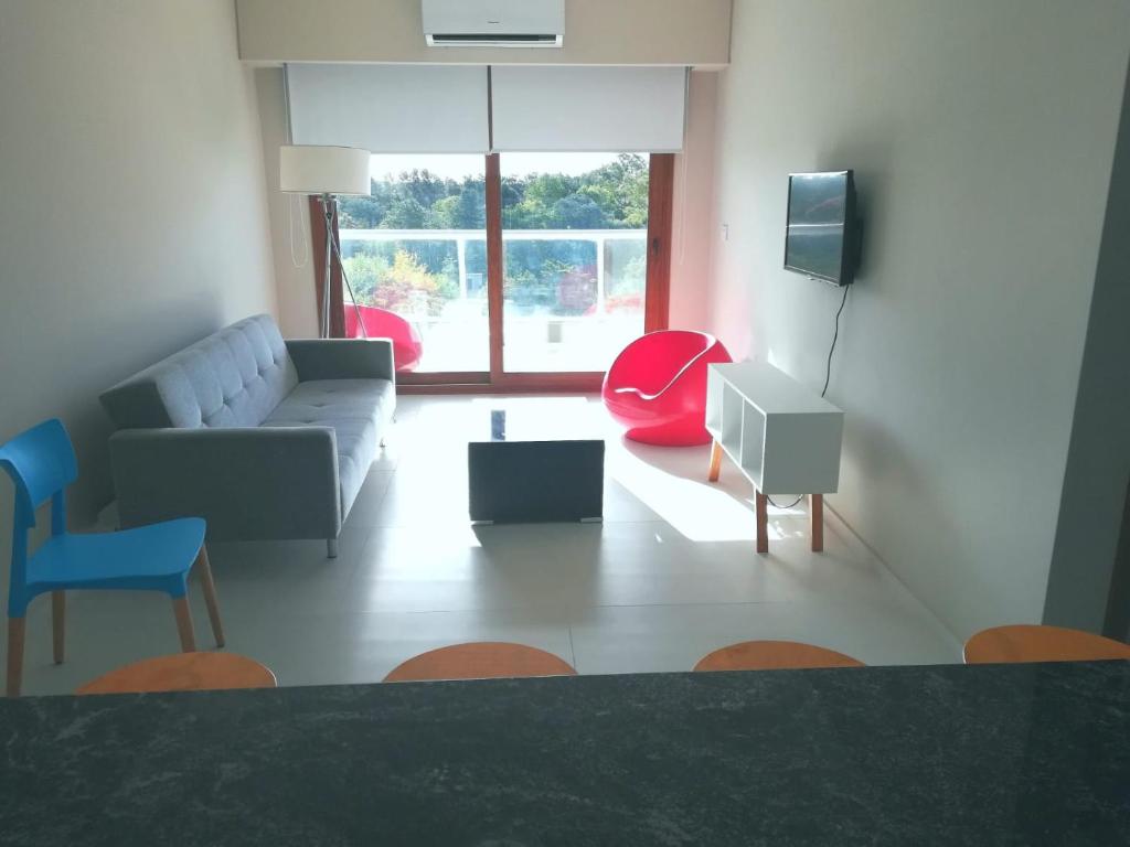 a living room with a couch and a tv at Canning Park premium apartment for 4 in Canning
