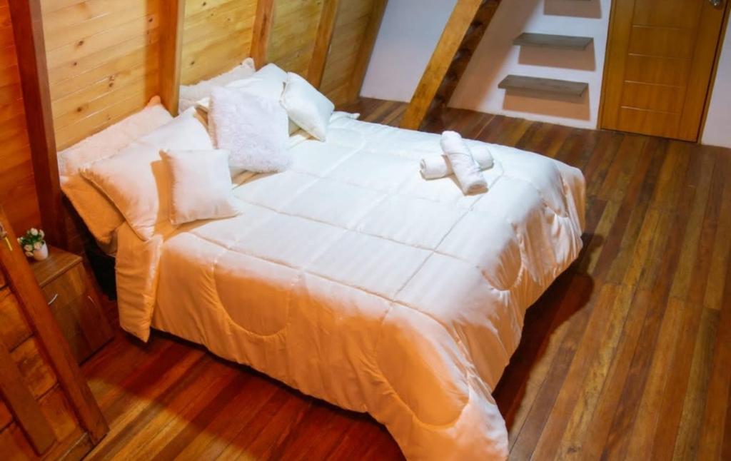 Postel nebo postele na pokoji v ubytování Cabañas Alpina