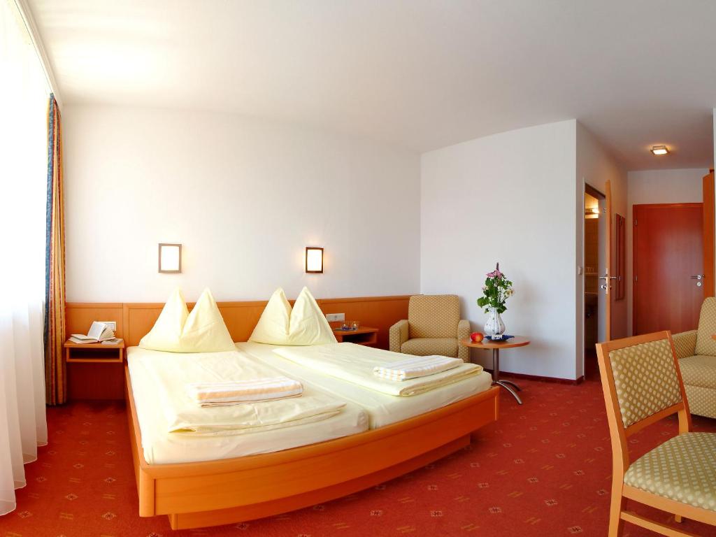 Ένα ή περισσότερα κρεβάτια σε δωμάτιο στο Hotel Alpengasthof Hochegger
