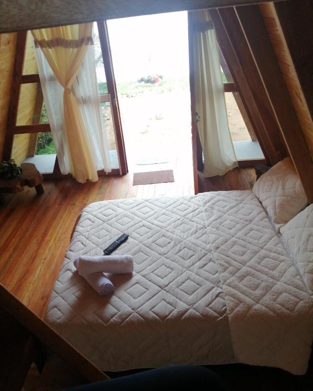 Postel nebo postele na pokoji v ubytování Cabañas Alpina