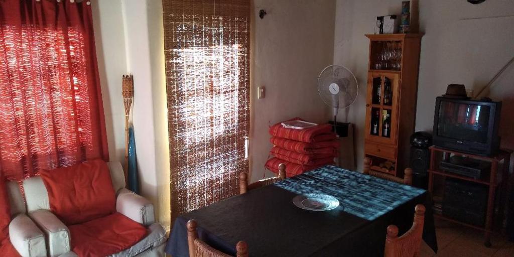 a living room with a table and a chair at charly in San Luis