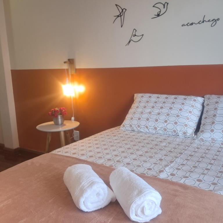 Postel nebo postele na pokoji v ubytování Casa Rosa Suítes 5 min de caminhada da PRAIA DA PONTA NGRA