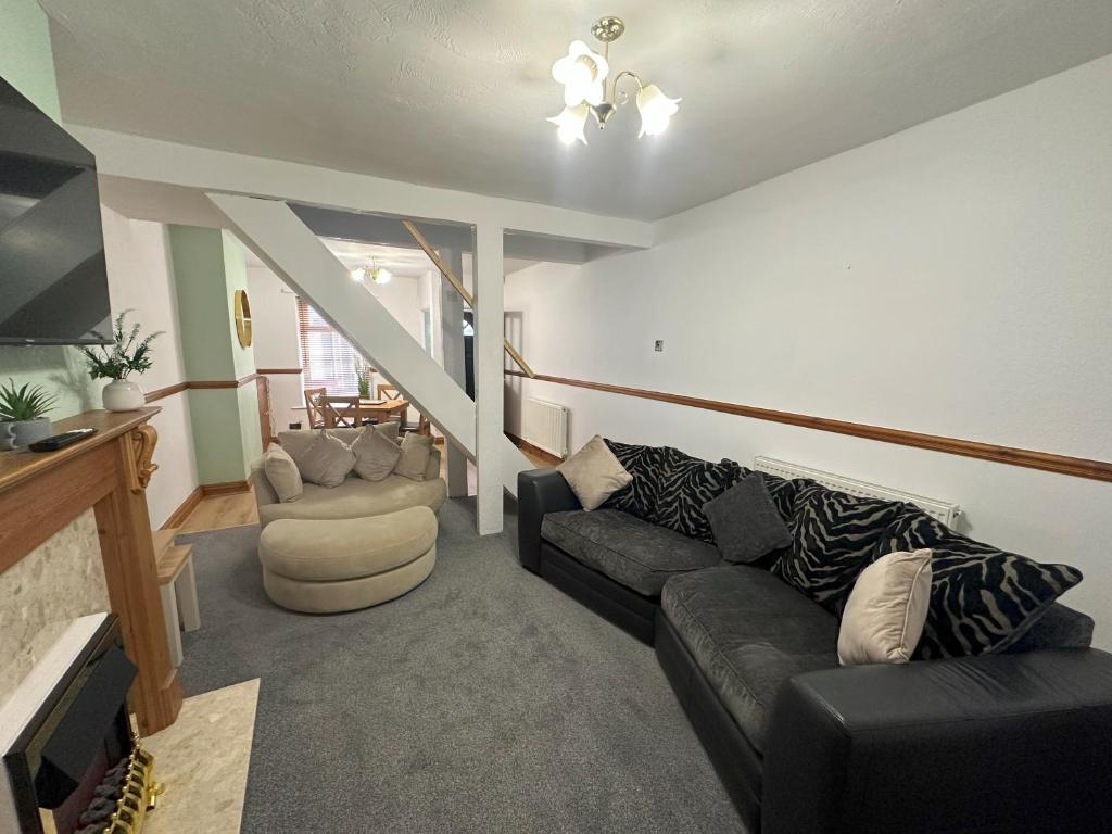 a living room with a couch and two chairs at Bolton Terrace - 2 Bedrooms - Sleeps 4 in Workington
