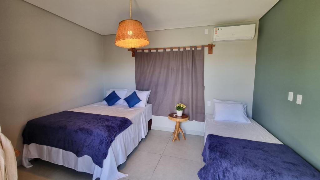 Giường trong phòng chung tại Casa Aconchego Lençóis