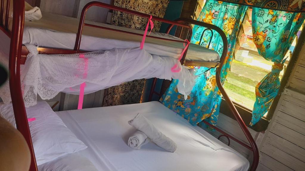 Postel nebo postele na pokoji v ubytování Tai Evi 2