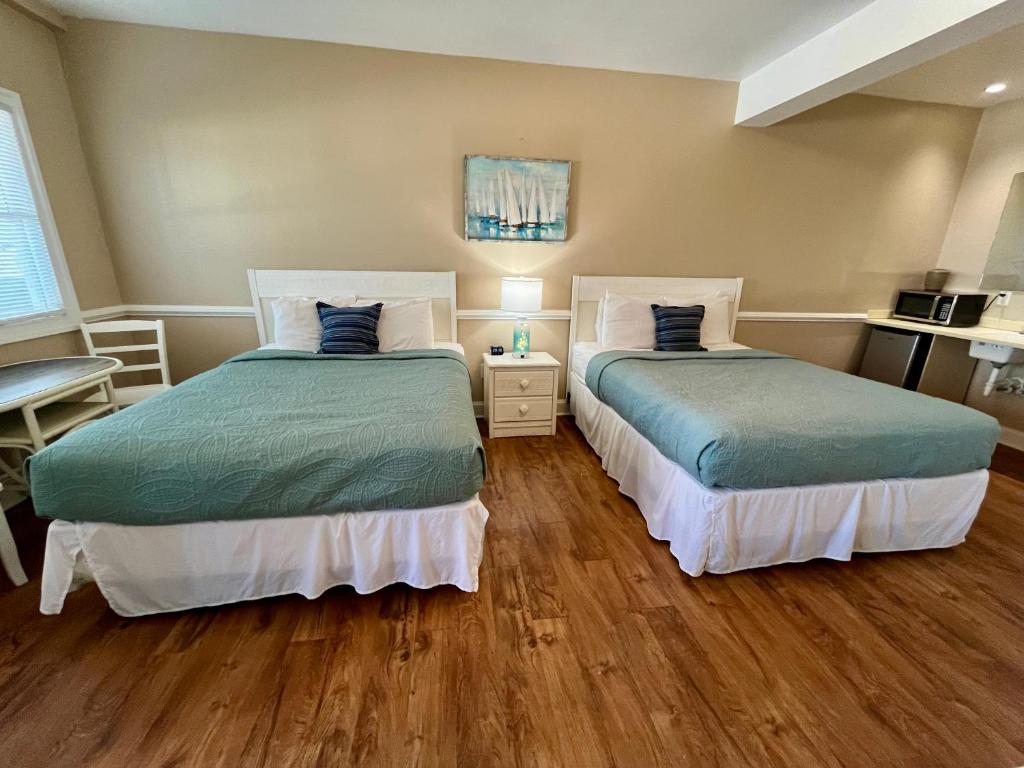 Postel nebo postele na pokoji v ubytování Cape Hatteras Motel