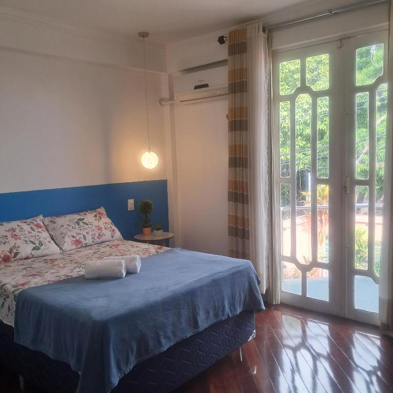 Postel nebo postele na pokoji v ubytování Casa Rosa Suítes 5 min de caminhada da PRAIA DA PONTA NGRA