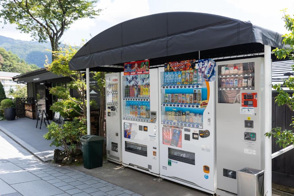 a group of vending machines in front of a building at Kawaguchiko Country Cottage Ban in Fujikawaguchiko