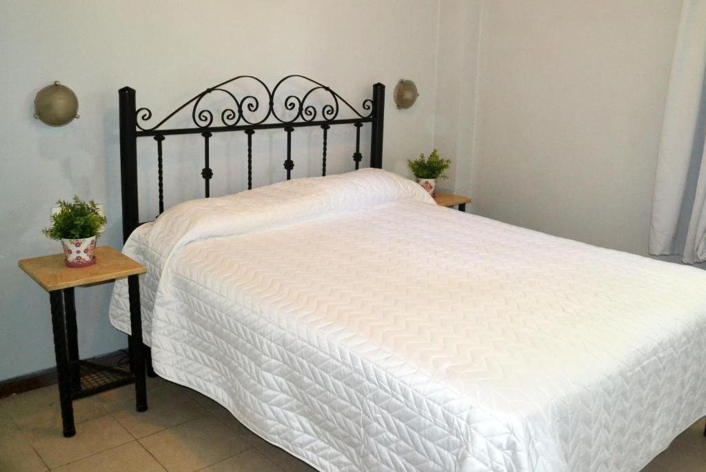 Cama o camas de una habitación en Hotel Sienna
