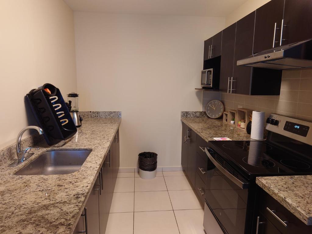 Kuchyň nebo kuchyňský kout v ubytování Moderno y cómodo apartamento