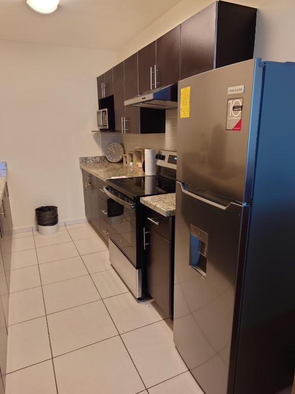 Kuchyň nebo kuchyňský kout v ubytování Moderno y cómodo apartamento